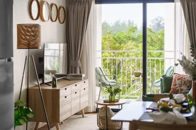 a living room with a view of a balcony at Title Halo Nature Touch 40m2 King Bed Naiyang in Nai Yang Beach