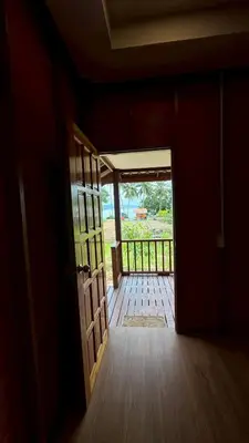 an open door to a room with a porch at Cheriya bungalow Kohyaonoi in Ban Laem Sai
