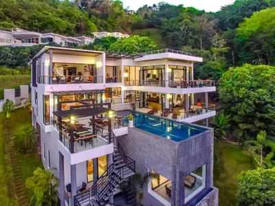an aerial view of a house with a swimming pool at Fully Serviced Grand Villa Luxury Time Phuket in Bang Tao Beach