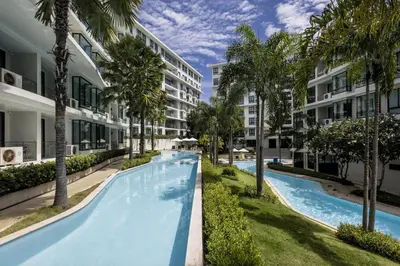 an image of a swimming pool at a resort at Studio Aurel 1BRTropical ViewsShuttle to NaiHarn in Rawai Beach