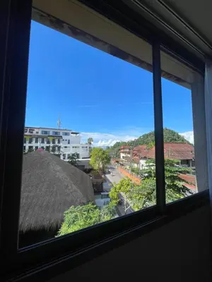 a window with a view of a city at Cozy corner in Ao Nang Beach