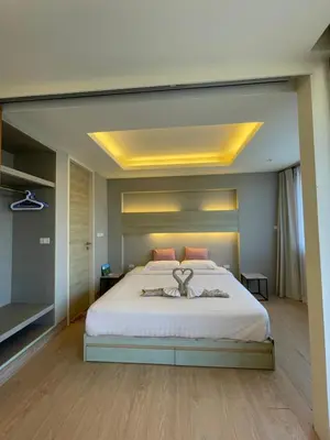 a bedroom with a large white bed in a room at Cozy corner in Ao Nang Beach