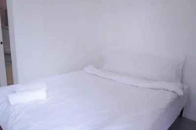 a white bed with two towels on top of it at XX BAO Pathong Beach เบา ป่าตอง บีช in Patong Beach