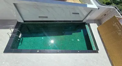 an overhead view of a swimming pool in a building at Smile Boutique at Saiyuan in Rawai Beach