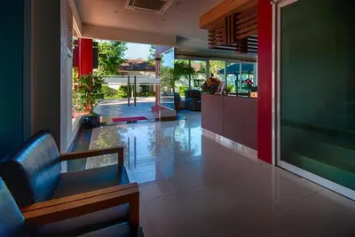 a lobby with a bench and a bar in a building at Cozy apartment at peaceful Rawai Condo in Rawai Beach