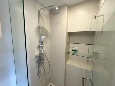 a shower with a glass door in a bathroom at Modern Laguna Skypark apartments by Lofty in Bang Tao Beach