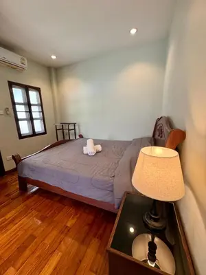 a bedroom with a bed with a stuffed animal on it at 103-25 Kathu Waterfall in Phuket Town