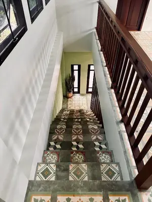 a stairway with a tile floor and a stair case at 103-25 Kathu Waterfall in Phuket Town