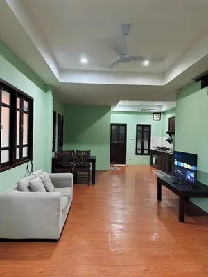a living room with a couch and a table at 103-25 Kathu Waterfall in Phuket Town