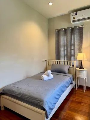 a bed with a pillow on it in a room at 103-25 Kathu Waterfall in Phuket Town