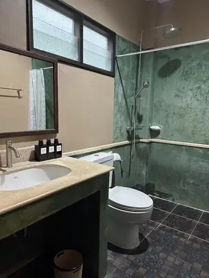 a bathroom with a toilet and a shower and a sink at 103-25 Kathu Waterfall in Phuket Town