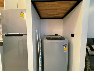 a room with a trash can next to a wall at Ground Floor Zen Space Kamala in Kamala Beach