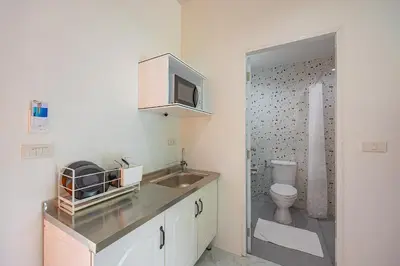 a bathroom with a sink and a toilet at Karon Hotel at 22 in Karon Beach