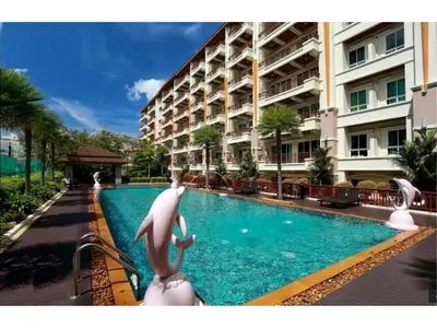 a swimming pool in front of a building at Nice Apartment large pool in nice residence central Patong beach in Patong Beach
