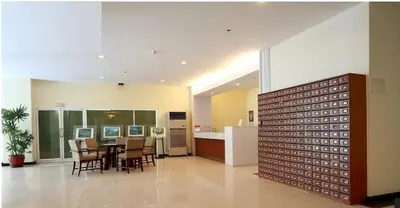 a dining room and kitchen with a table and chairs at Nice Apartment large pool in nice residence central Patong beach in Patong Beach