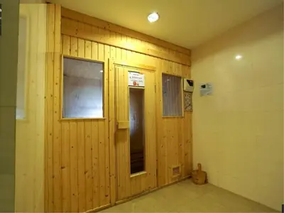 a room with a wooden wall with a window at Nice Apartment large pool in nice residence central Patong beach in Patong Beach