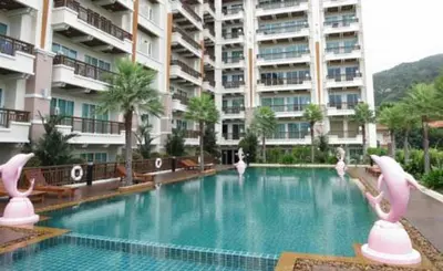 a swimming pool with flamingos in a hotel at Nice Apartment large pool in nice residence central Patong beach in Patong Beach