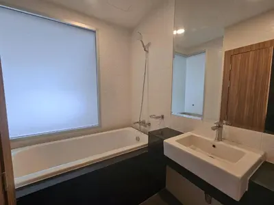 a bathroom with a white tub and a sink at The Olive Studio Room at Chic Condominium in Karon Beach