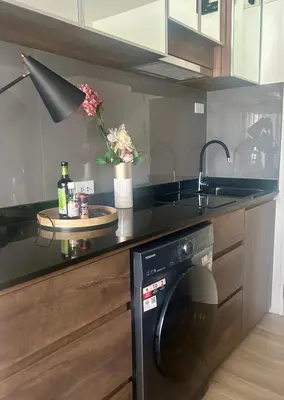 a kitchen with a washer and dryer on a counter at Zcape 2 Boat Avenue, Laguna Brand New Renovated One bedroom Apartment with the Mountain View in Bang Tao Beach