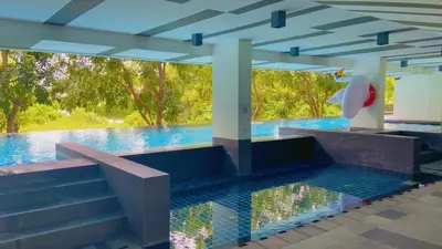 a pool in a building with a swimming pool at Zcape 2 Boat Avenue, Laguna Brand New Renovated One bedroom Apartment with the Mountain View in Bang Tao Beach