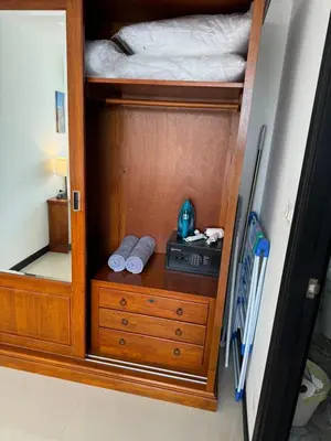 a bedroom with a bunk bed and a dresser with a bed at Apartment Mai Khao Beach in Mai Khao Beach