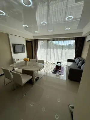 a living room with a table and a couch at Apartment Mai Khao Beach in Mai Khao Beach