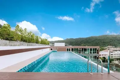 a swimming pool on the roof of a building at Beach Life & Surf Thrills, Stay at Kata Suite 8-132 in Kata Oasis Residence in Kata Beach