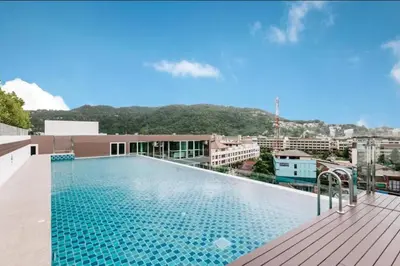 a swimming pool on the roof of a building at Beach Life & Surf Thrills, Stay at Kata Suite 8-132 in Kata Oasis Residence in Kata Beach