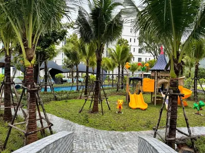 a park with a playground with palm trees at Super Naiyang Title 1Bdr 600m to beach in Nai Yang Beach