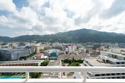 a view of a city from a balcony at Patong Tower Brand 1-Bedroom apartment mountain view , Near Beach in Patong Beach