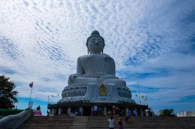 a large statue sitting on top of some stairs at Meet Holiday International Hotel-Patong \u666e\u5409\u5c9b\u76f8\u9047\u56fd\u9645\u5ea6\u5047\u9152\u5e97-\u82ad\u4e1c\u5e97 in Patong Beach