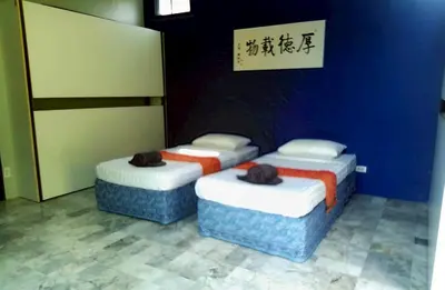 three beds in a room with a blue wall at Bulan Anda Resort in Ban Hua Laem