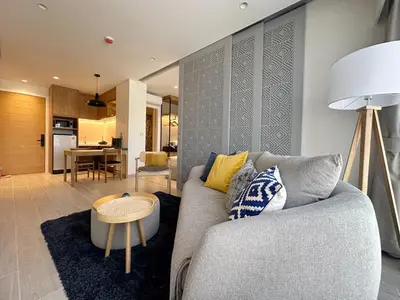 a living room with a couch and a table at Laguna Lakeside in Bang Tao Beach