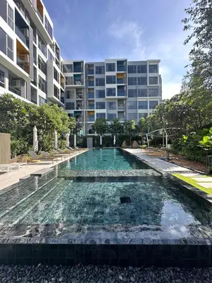 a swimming pool in front of a building at Laguna Lakeside in Bang Tao Beach