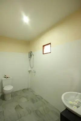 a bathroom with a toilet and a sink at Bida Daree Resort in Ao Nang Beach