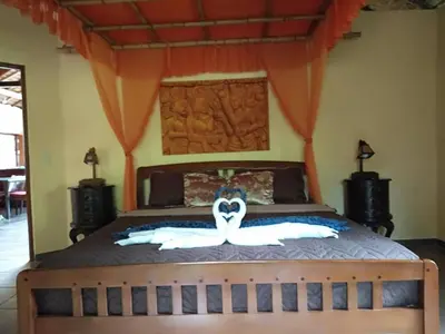 a bedroom with a bed with a canopy at Cliffside Lagoon Villa in Ao Nang Beach