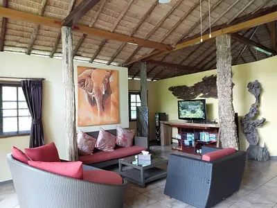 a living room with two couches and a tv at Cliffside Lagoon Villa in Ao Nang Beach