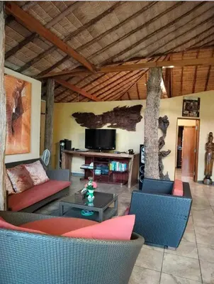 a living room with a couch and a table at Cliffside Lagoon Villa in Ao Nang Beach