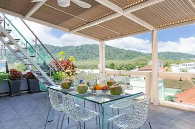 a table and chairs on a patio with a view at V270 Best View In Phuket Hot Tub Great Location in Rawai Beach