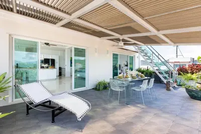 a patio with chairs and a table and a staircase at V270 Best View In Phuket Hot Tub Great Location in Rawai Beach