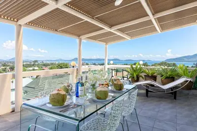 a table and chairs on a balcony with a view at V270 Best View In Phuket Hot Tub Great Location in Rawai Beach