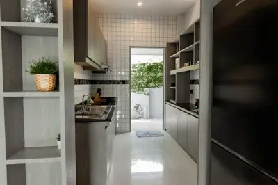 a kitchen with a sink and a counter top at Udomsuk Pool Villa Krabi in Ban Khlong Haeng