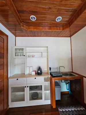 a small kitchen with a sink in a room at Tiny 1-2 in Rawai Beach