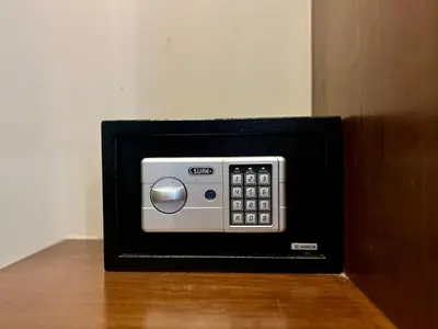 a small microwave oven sitting on top of a table at The Regent Bangtao by RESAVA in Bang Tao Beach