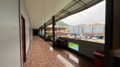 a hallway of a building with a view of a city at Fahsai Hostel in Ao Nang Beach