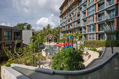 a playground in front of a apartment building at Apartment in Mida Grande Surin in Surin Beach