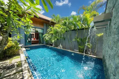 a swimming pool in the backyard of a house at Onyx 2 br private pool Rawai in Ban Saiyuan (1)