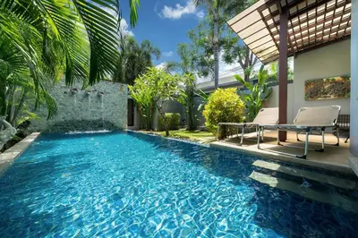a swimming pool in the backyard of a house at Onyx 2 br private pool Rawai in Ban Saiyuan (1)