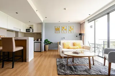 a living room with a couch and a table at Apart Close to the Beach Sea view in Rawai Beach