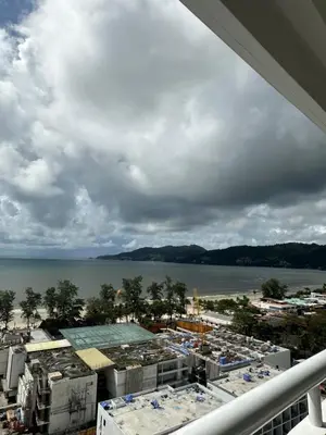 a view of the water from the balcony of a building at Patong Tower sea view 2B in Patong Beach